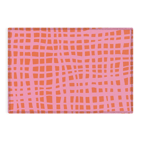 Angela Minca Retro grid orange and pink Outdoor Rug