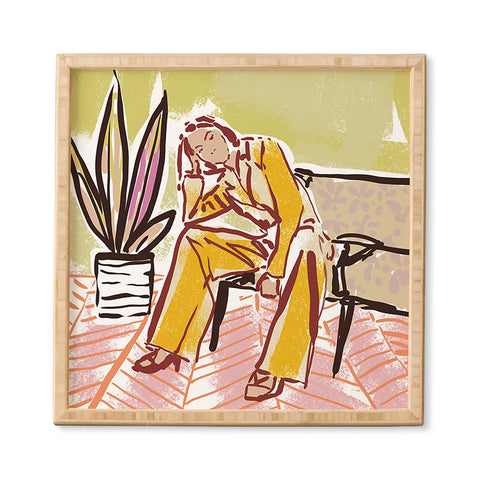 DESIGN d´annick Woman sitting on sofa Framed Wall Art