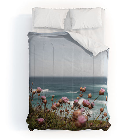 Henrike Schenk - Travel Photography Pink Flowers by the Ocean Comforter
