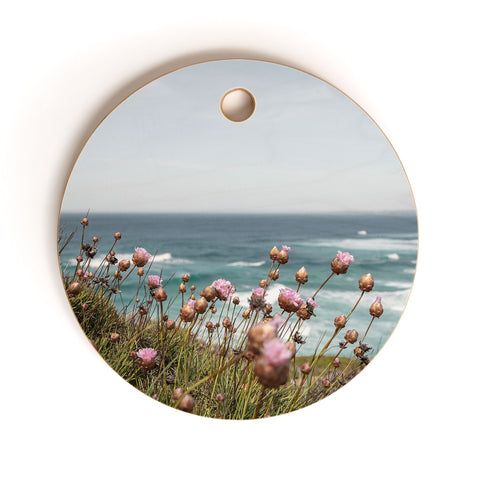 Henrike Schenk - Travel Photography Pink Flowers by the Ocean Cutting Board Round