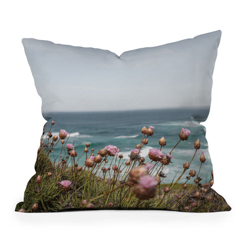 Henrike Schenk - Travel Photography Pink Flowers by the Ocean Outdoor Throw Pillow