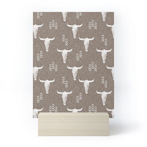 Little Arrow Design Co cow skulls on taupe Mini Art Print