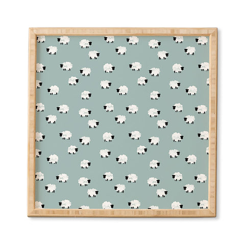Little Arrow Design Co sheep on dusty blue Framed Wall Art