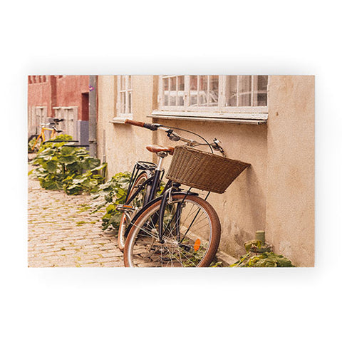 Ninasclicks A bicycle in a Copenhagen street Welcome Mat