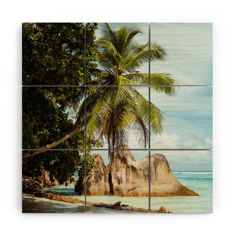 Pita Studios Palm tree bending over the sea Wood Wall Mural