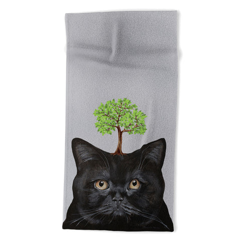 Coco de Paris A black cat with a tree Beach Towel