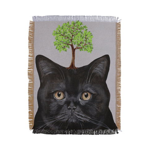Coco de Paris A black cat with a tree Throw Blanket