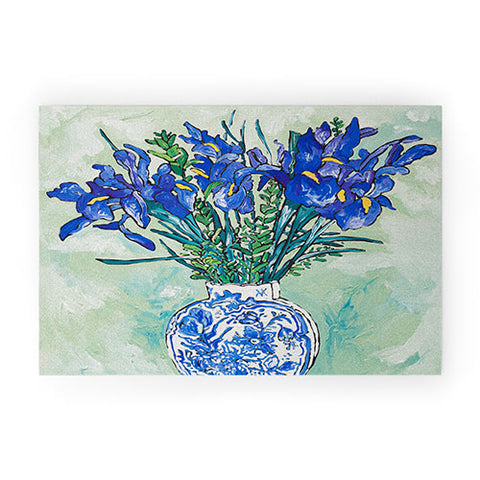 Lara Lee Meintjes Iris Bouquet in Chinoiserie Vase on Blue and White Striped Tablecloth on Painterly Mint Green Welcome Mat
