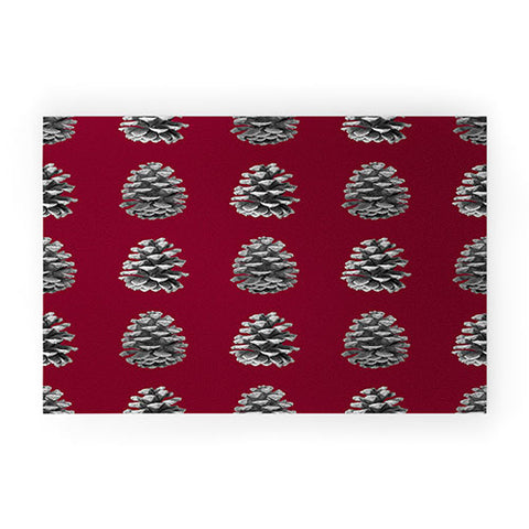 Lisa Argyropoulos Monochrome Pine Cones and Red Welcome Mat