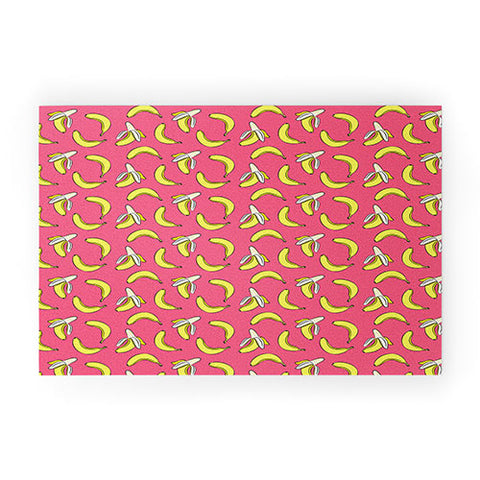 Little Arrow Design Co Bananas on Pink Welcome Mat