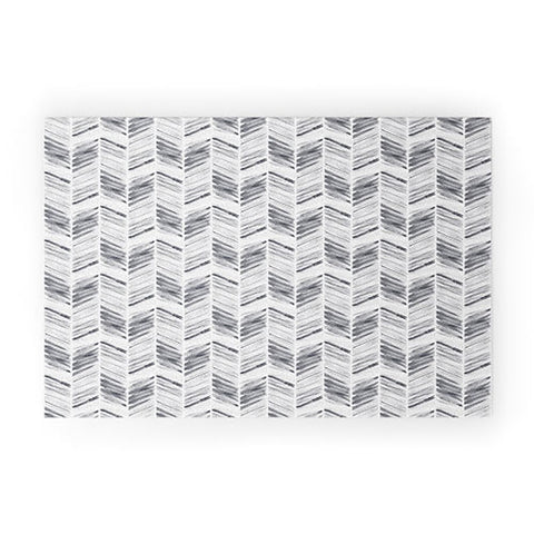 Little Arrow Design Co watercolor feather in grey Welcome Mat