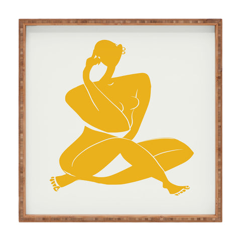 Little Dean Nude sitting in yellow Square Tray