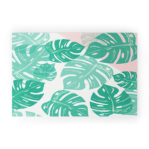 Bianca Green Linocut Monstera Rosy Welcome Mat