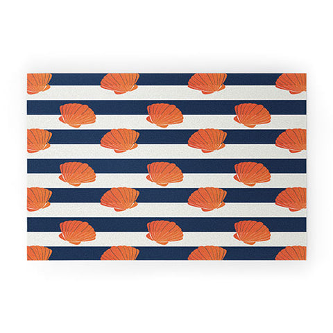 Cynthia Haller Orange clamshell and navy Welcome Mat