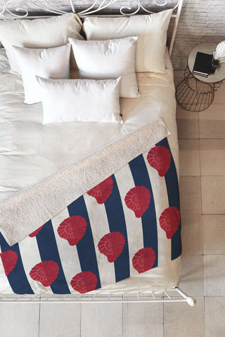 Cynthia Haller Red nautilus shell and navy Fleece Throw Blanket