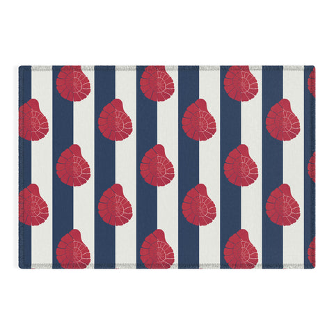 Cynthia Haller Red nautilus shell and navy Outdoor Rug