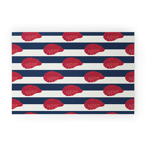Cynthia Haller Red nautilus shell and navy Welcome Mat