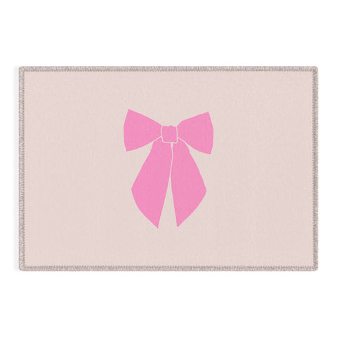 Daily Regina Designs Pink Bow Outdoor Rug