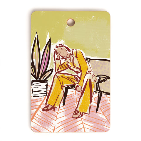 DESIGN d´annick Woman sitting on sofa Cutting Board Rectangle