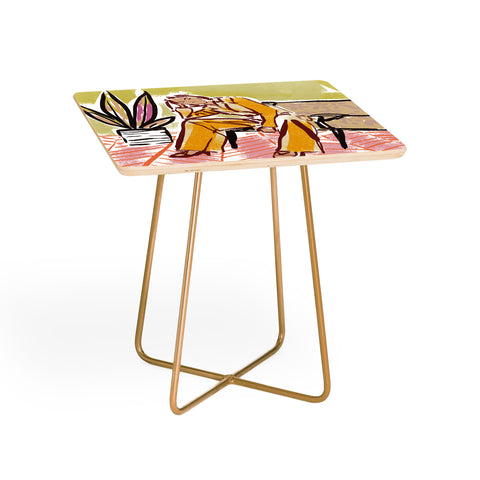 DESIGN d´annick Woman sitting on sofa Side Table