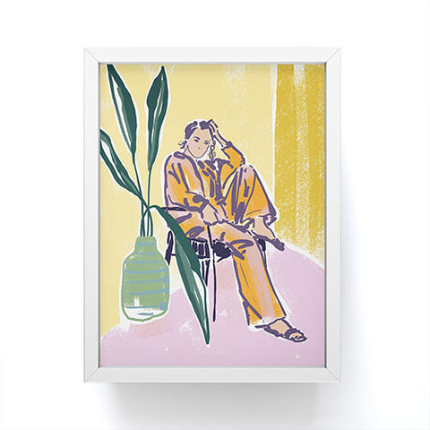 DESIGN dannick Woman wearing yellow pajamas Framed Mini Art Print