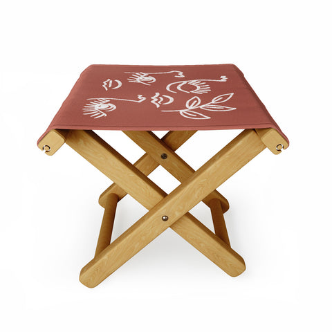 Emanuela Carratoni Line Art Portraits on Brown Folding Stool