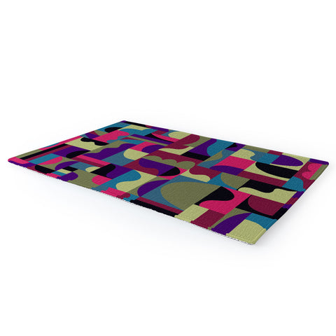 Gigi Rosado Geometric collage patchouli Area Rug
