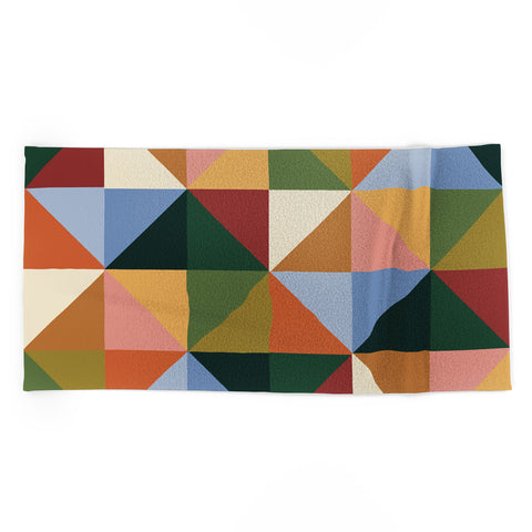 Gigi Rosado Warm triangles Beach Towel