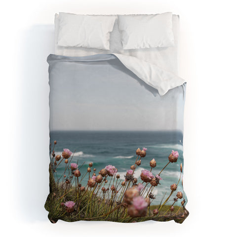 Henrike Schenk - Travel Photography Pink Flowers by the Ocean Duvet Cover