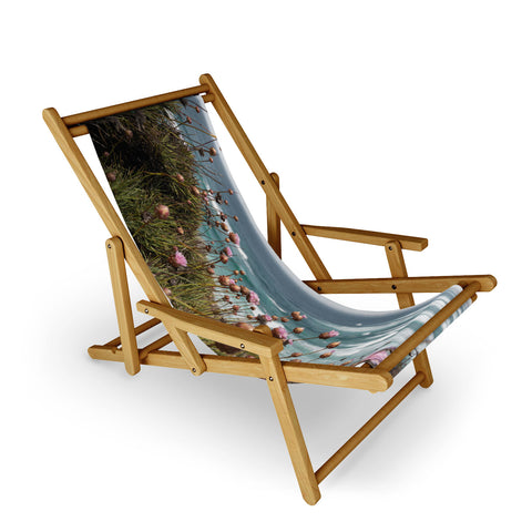 Henrike Schenk - Travel Photography Pink Flowers by the Ocean Sling Chair