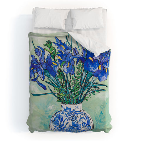 Lara Lee Meintjes Iris Bouquet in Chinoiserie Vase on Blue and White Striped Tablecloth on Painterly Mint Green Duvet Cover