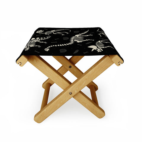 Lathe & Quill Dinosaur Fossils on Black Folding Stool