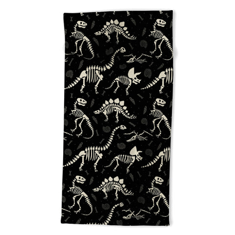 Lathe & Quill Dinosaur Fossils on Black Beach Towel