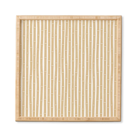 Little Arrow Design Co bamboo tiki gold Framed Wall Art