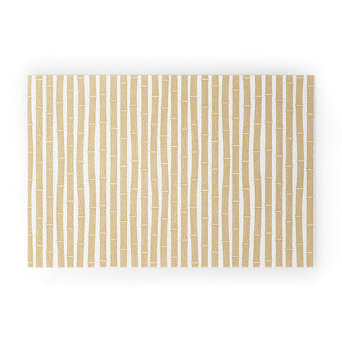 Little Arrow Design Co bamboo tiki gold Welcome Mat