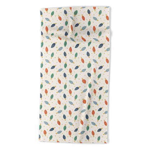 Little Arrow Design Co christmas lights on cream Beach Towel