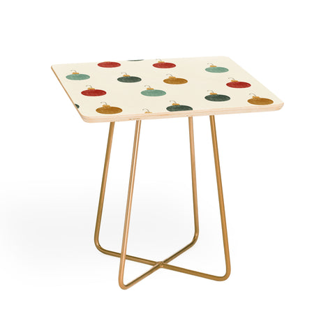 Little Arrow Design Co christmas ornaments on cream Side Table