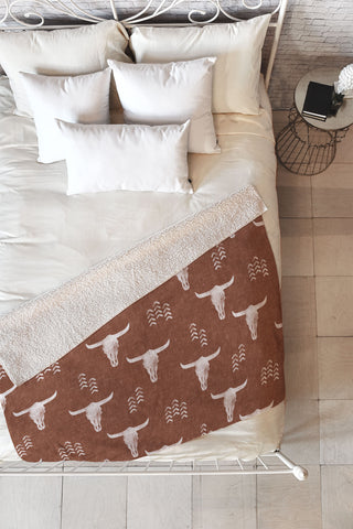 Little Arrow Design Co cow skulls on rust Fleece Throw Blanket