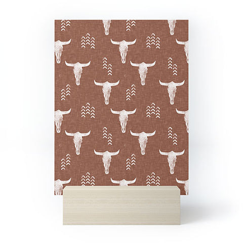 Little Arrow Design Co cow skulls on rust Mini Art Print