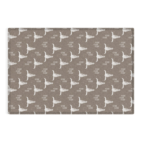 Little Arrow Design Co cow skulls on taupe Outdoor Rug