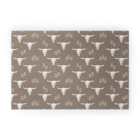 Little Arrow Design Co cow skulls on taupe Welcome Mat