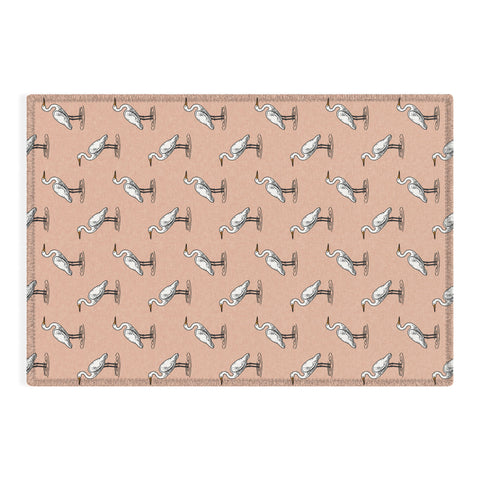 Little Arrow Design Co egrets on peach Outdoor Rug
