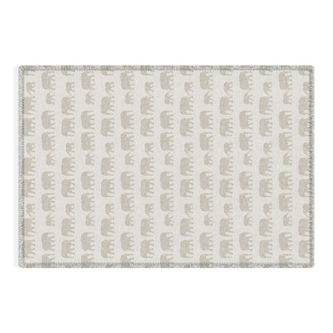 Little Arrow Design Co elephants marching khaki Outdoor Rug