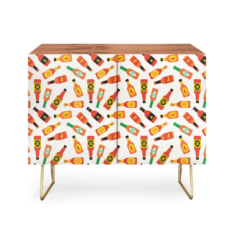 Little Arrow Design Co hot sauce bottles on cream Credenza