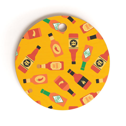 Little Arrow Design Co hot sauce bottles on yellow Cutting Board Round
