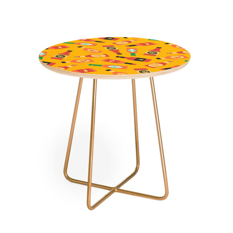 Little Arrow Design Co hot sauce bottles on yellow Round Side Table