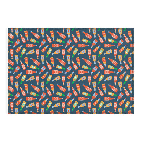 Little Arrow Design Co hot sauces bottles on blue Outdoor Rug
