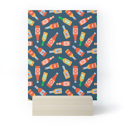 Little Arrow Design Co hot sauces bottles on blue Mini Art Print