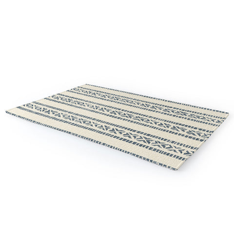 Little Arrow Design Co oceania vertical stripes navy Area Rug