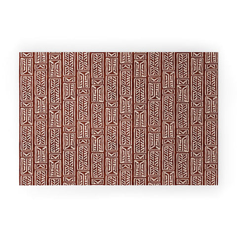 Little Arrow Design Co rayleigh feathers rust Welcome Mat